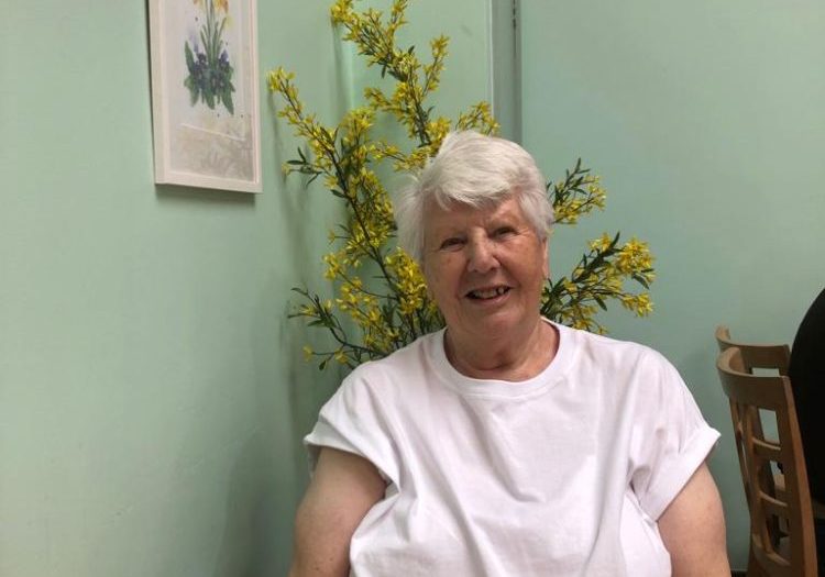 Lilian Tubb Lilian, sitting at a table in a cafe
